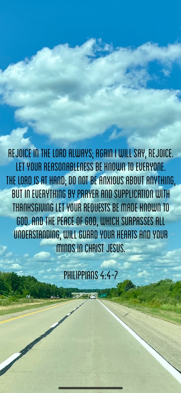 A road under a blue sky with Philippians 4:4–7 on rejoicing, prayer, thanksgiving, and the peace of God.